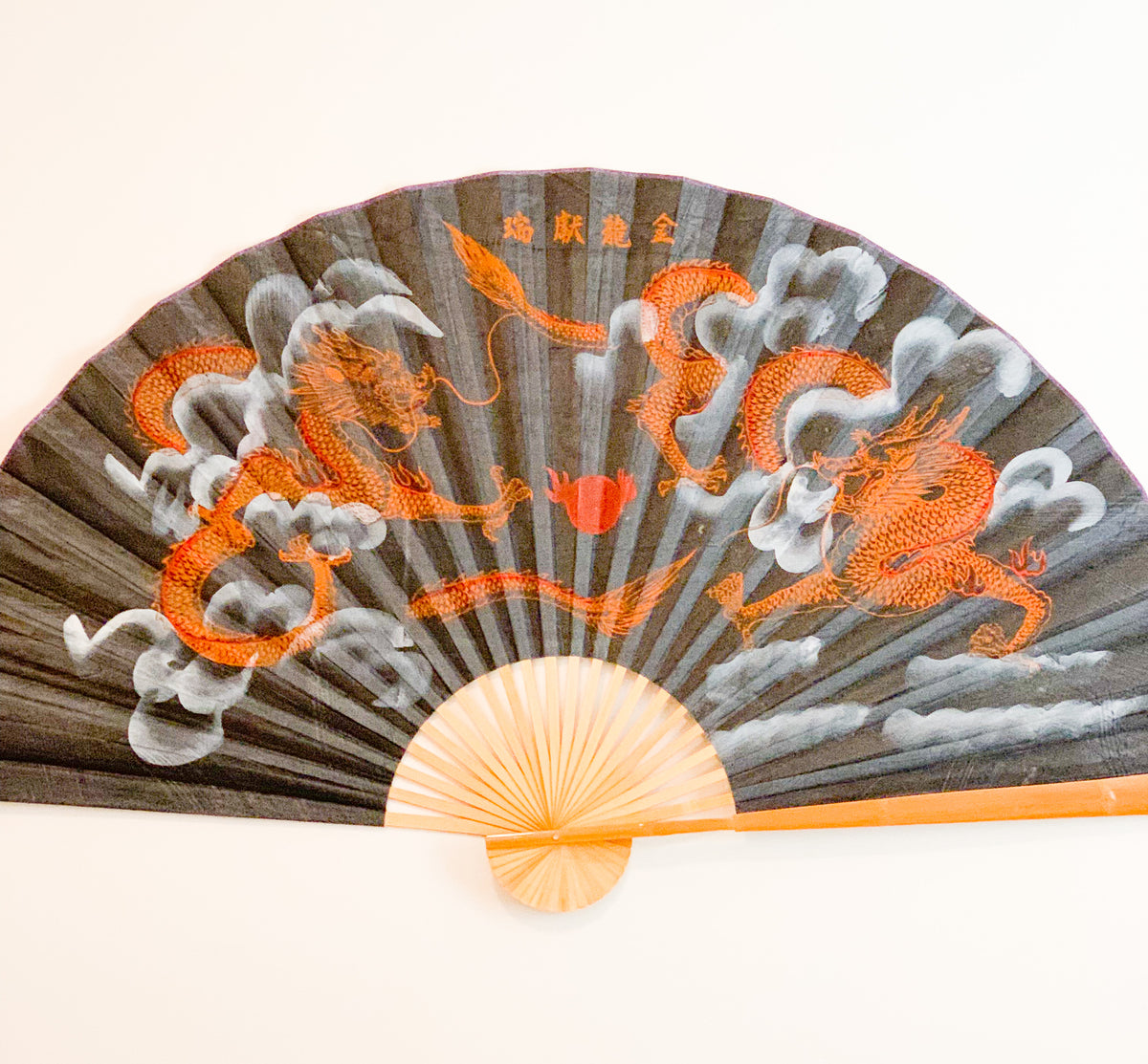 63-INCH EXTRA LARGE DECORATIVE WALL FAN — TWIN GOLDEN DRAGONS & FLAMING PEARL ON TEXTURED DARK CHARCOAL BACKGROUND